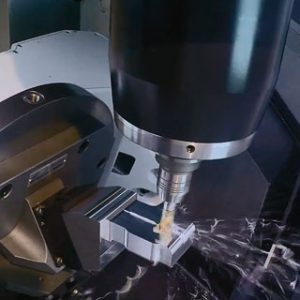 5-axis CNC machining head cutting a component at CNTL
