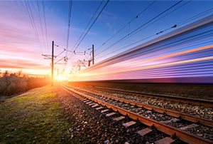 High-speed train passing at dusk