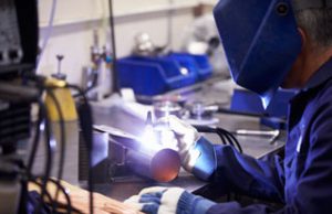 Welder fabricating a steel component at CNTL